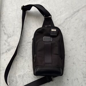 Tumi Black Sling Bag Compact and Stylish